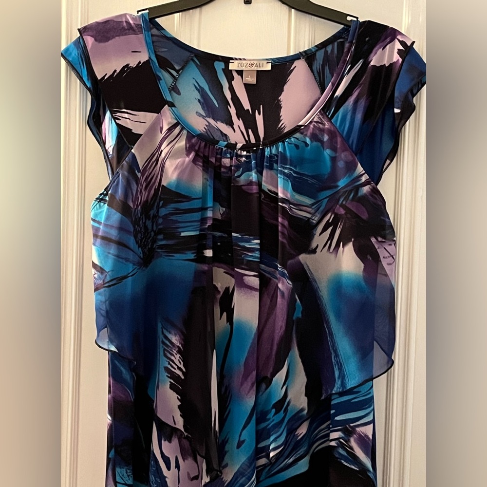 Roz & Ali sleeveless top with front handkerchief panel.